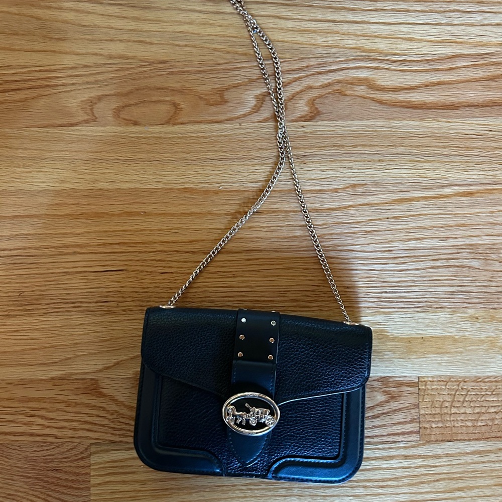Black Crossbody Bag with Silver Chain Strap and Structured Design